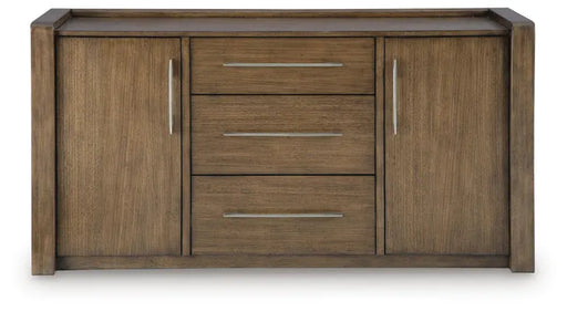 Straight-on front view of Ashley Marxmore Dining Room Server (D863-60), showcasing its modern rectangular silhouette, three central storage drawers, two closed cabinet doors, silver-tone bar handles, and rich brown wood finish.