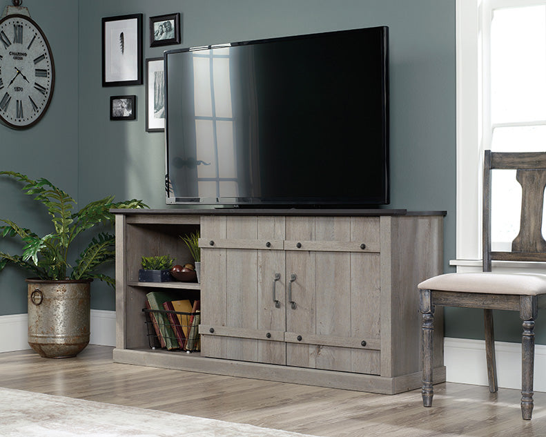 Farmhouse entertainment credenza with sliding barn doors in Mystic Oak